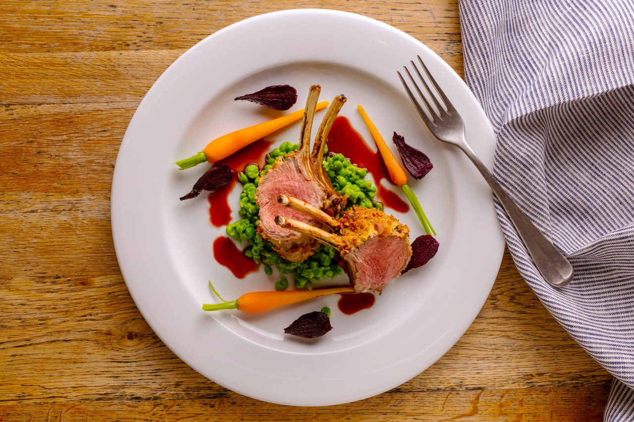 Herb-crusted lamb rack with red wine jus